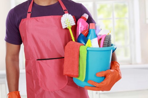 Professional carpet cleaners beginning a deep clean in an Ealing home